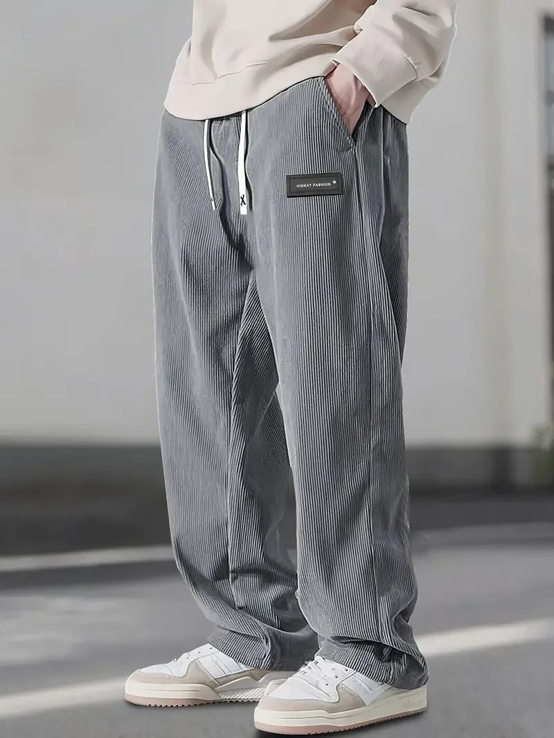 Casual autumn fashion: soft corduroy wide leg pants, unisex, offering a relaxed fit.