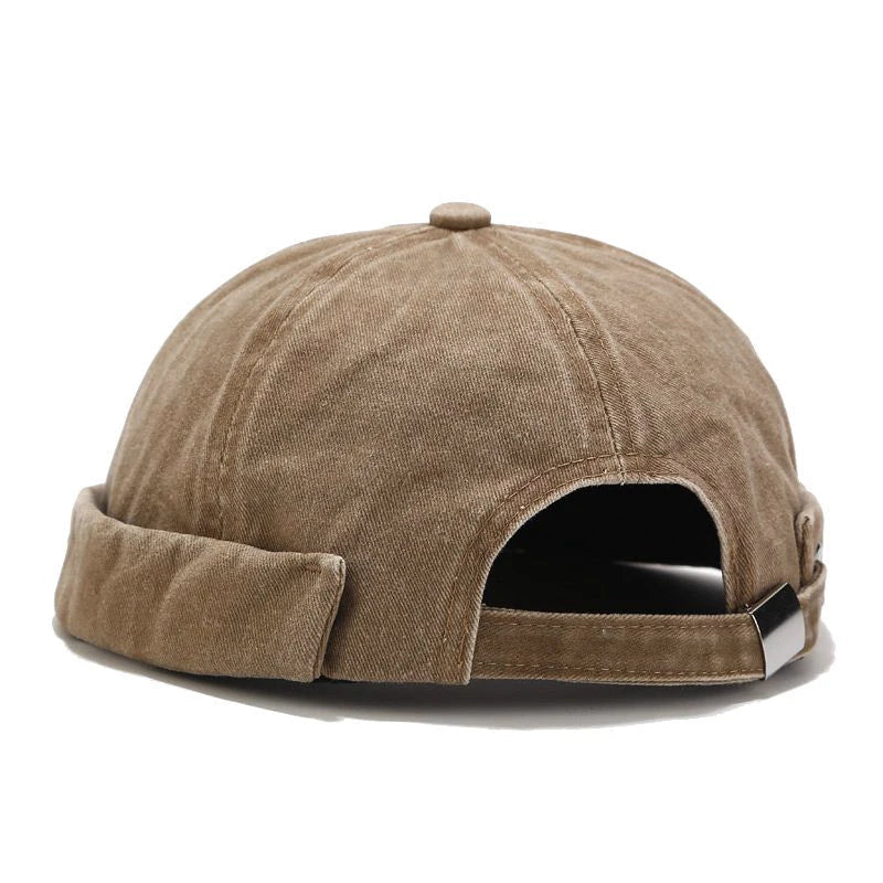 Soft cotton beanie for men & women, adjustable & breathable. Essential fall/winter accessory for casual look.