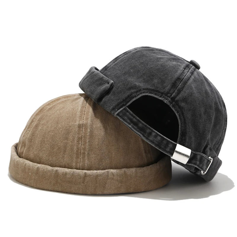 Black unisex soft cotton beanie hat, adjustable for a snug fit. Versatile men's/women's winter accessory.