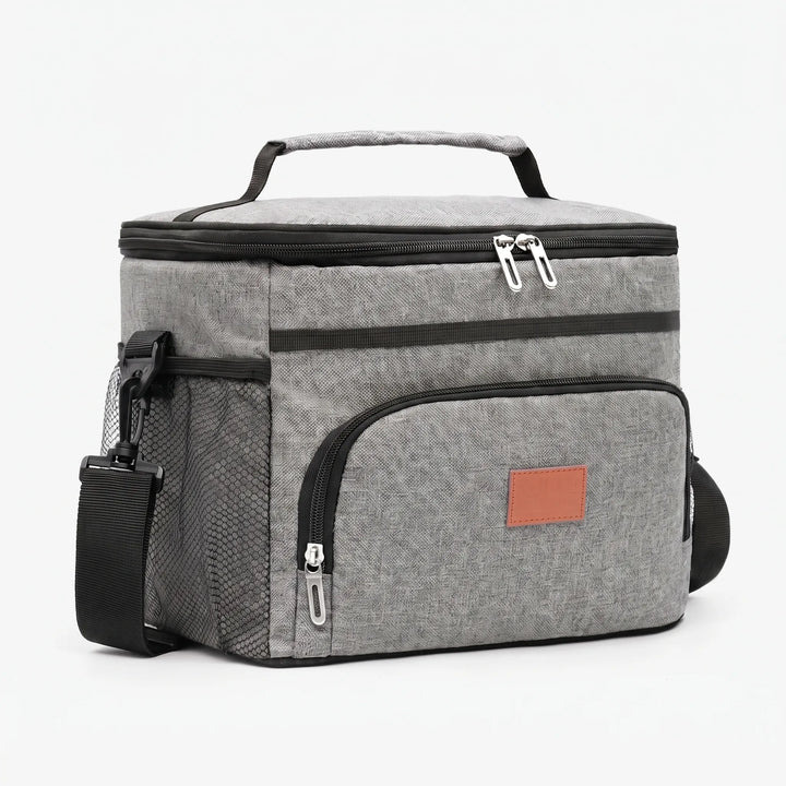 Portable insulated lunch bag with soft sides, ideal for keeping food cool for work, school, or outdoor adventures.