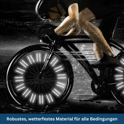 Unisex Spoke Reflectors in action, reflecting car headlights for increased cycling visibility & bike safety at night