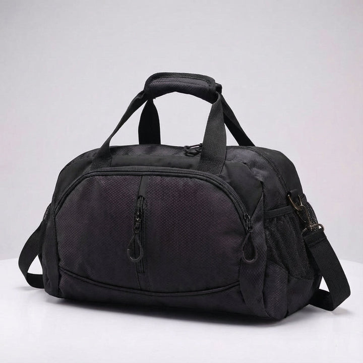 Compact unisex carry-on travel bag fitting in an overhead bin, a lightweight & durable duffel.