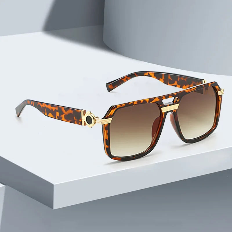 Fashionable unisex square sunglasses, offering UV400 eye protection. Features gradient lenses.