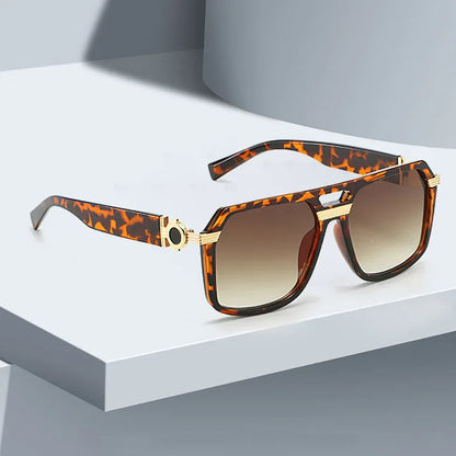 Fashionable unisex square sunglasses, offering UV400 eye protection. Features gradient lenses.