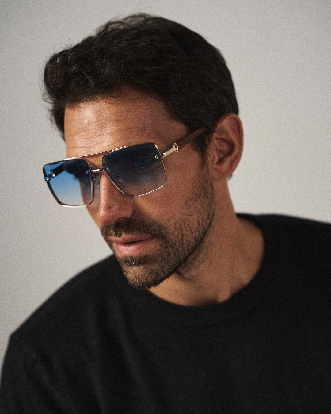 Vintage-inspired unisex square shades with bold wood arms, perfect urban fashion accessory.