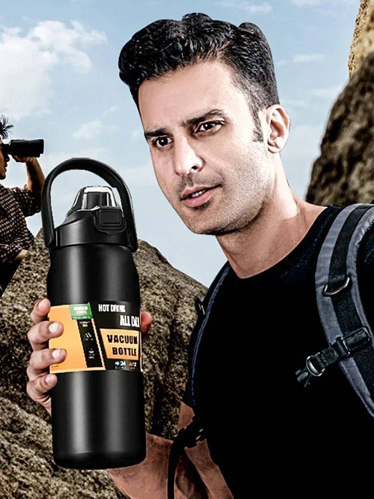 Travel-friendly insulated water bottle, stainless steel with a convenient flip-up straw and handle.