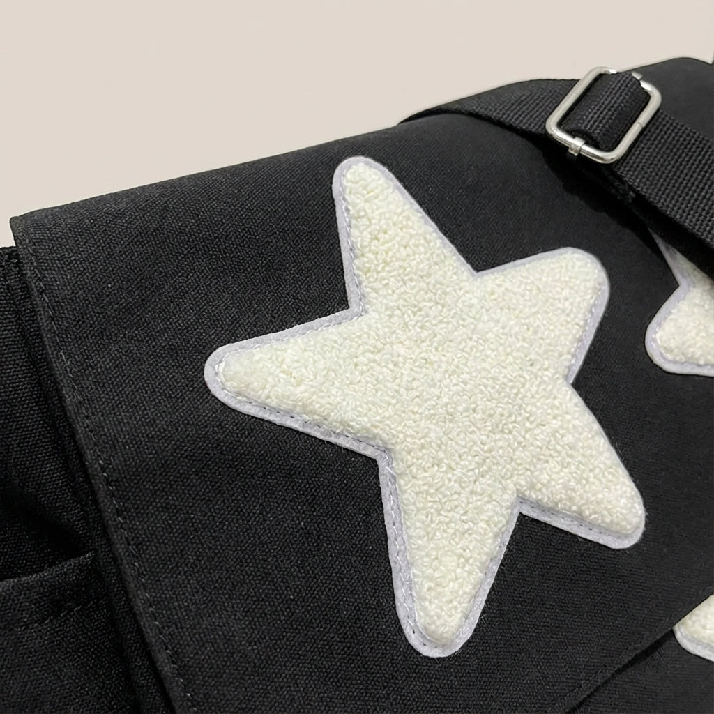 Lightweight unisex star print messenger bag. Water-resistant shoulder bag, ideal for daily commutes & organized travel.