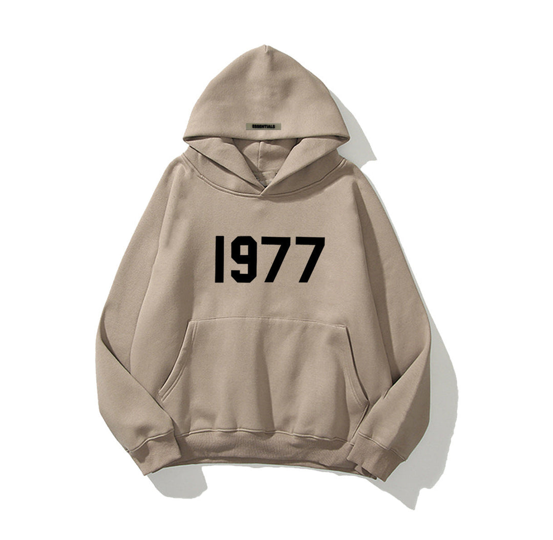 Comfortable unisex pullover hoodie featuring a retro 1977 graphic and raglan sleeves.