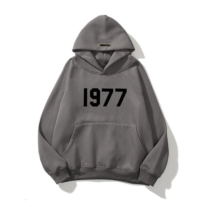 Stylish 1977 print hoodie with raglan sleeves, ideal for a comfortable, casual streetwear look.