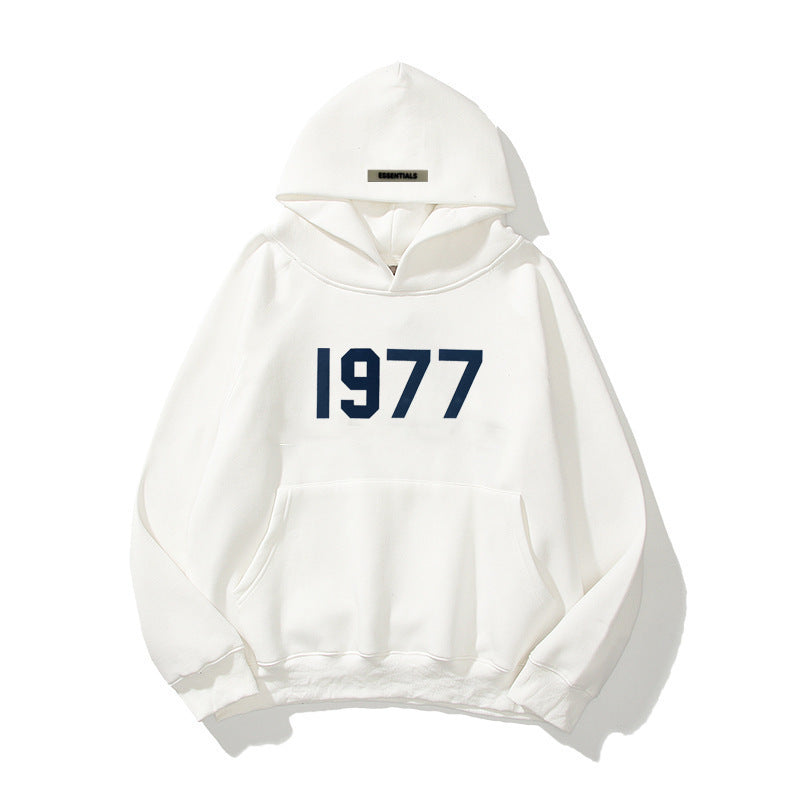 Vintage style hooded pullover with a bold 1977 print and modern raglan sleeve construction.