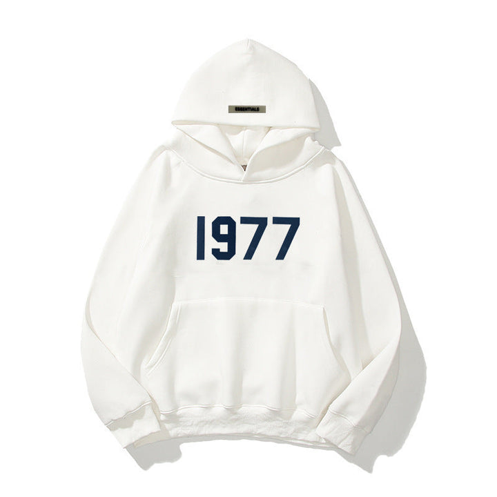 Vintage style hooded pullover with a bold 1977 print and modern raglan sleeve construction.