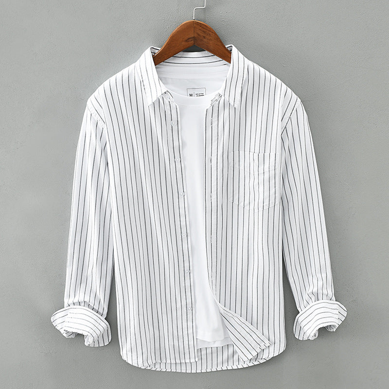 Unisex striped button-up shirt in light fabric, perfect for warm weather and casual summer styling.