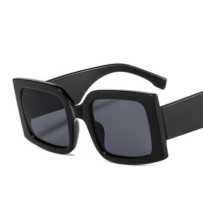 Modern unisex polycarbonate square sunglasses, offering superior UV protection for eyes.