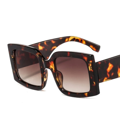 Cool square frame sunglasses providing full UV protection, a must-have unisex summer accessory.
