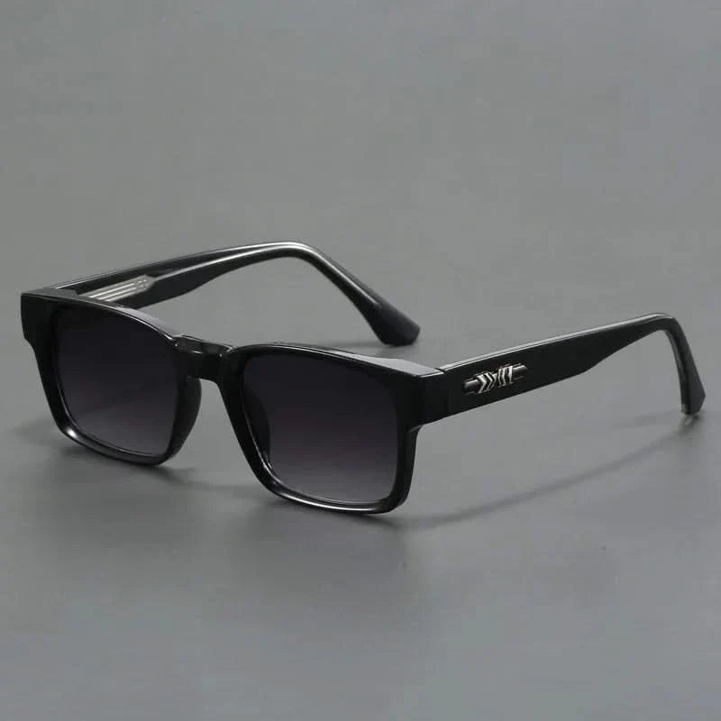 Elegant squared sunglasses with UV protection. Unisex eyewear for a chic and protected look.