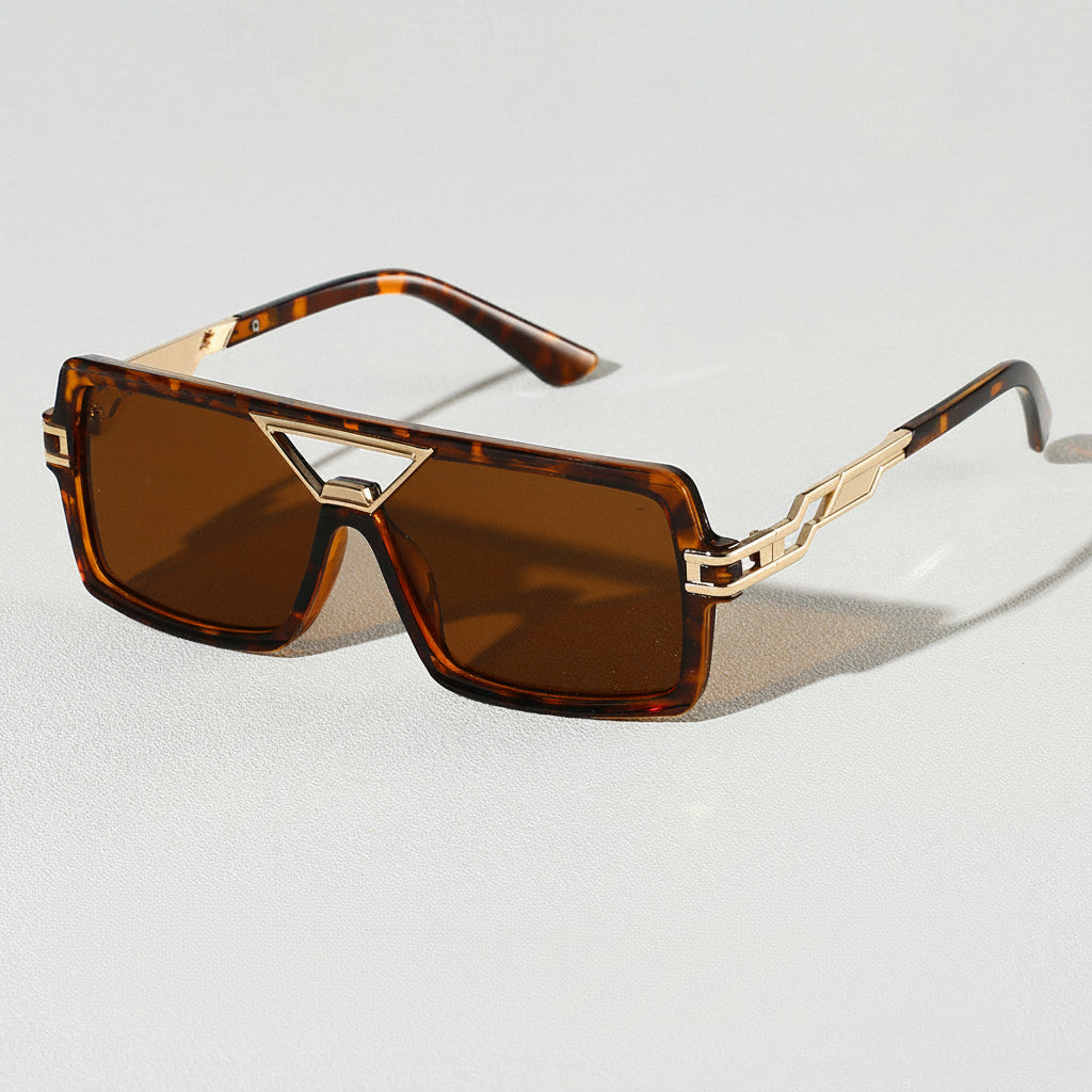 Stylish unisex sunglasses featuring elegant gold metal frames and crucial UV400 eye protection.