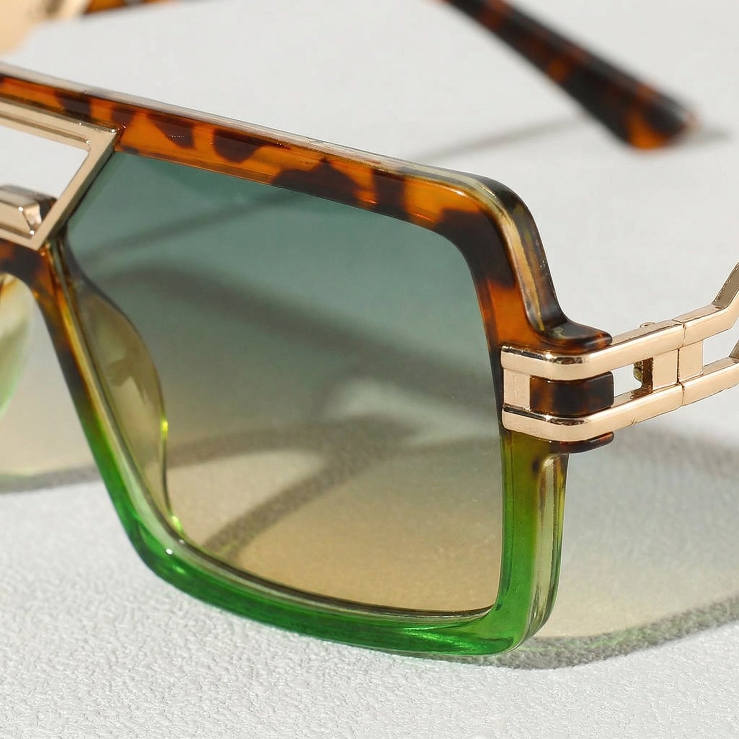Detailed view of the intricate metal frame of stylish unisex UV400 sunglasses for optimal eye protection.