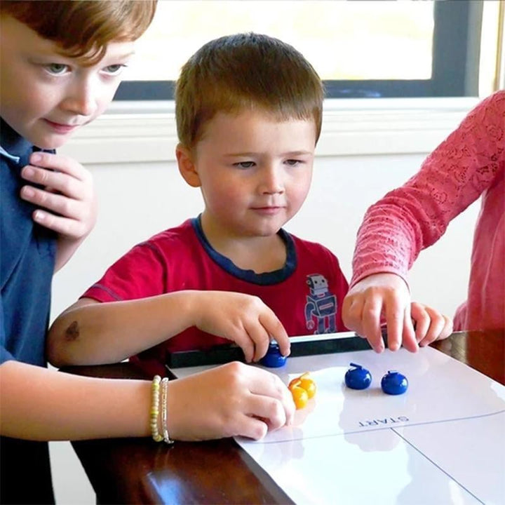 Unisex Tabletop Curling game for all ages, featuring a smooth playing surface and colorful stones.