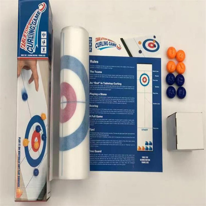 Adults competing in a lively Tabletop Curling party game, enjoying portable board game fun.