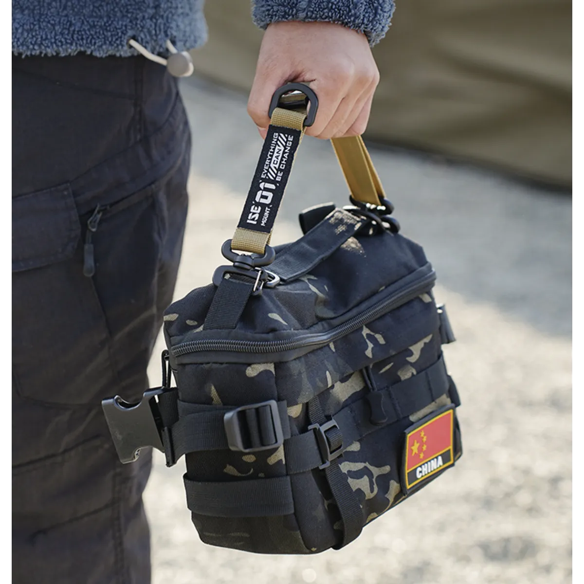 Close-up of tactical utility clip, robust design for secure gear organization and outdoor use