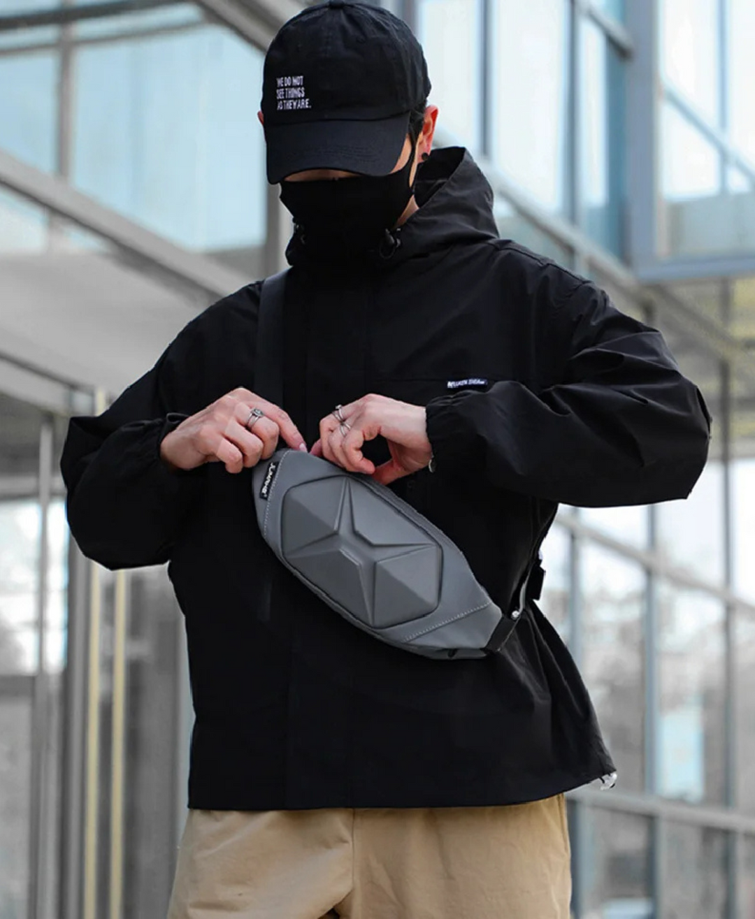 Tactical hard shell crossbody bag in action, demonstrating its compact and secure fit for travel.