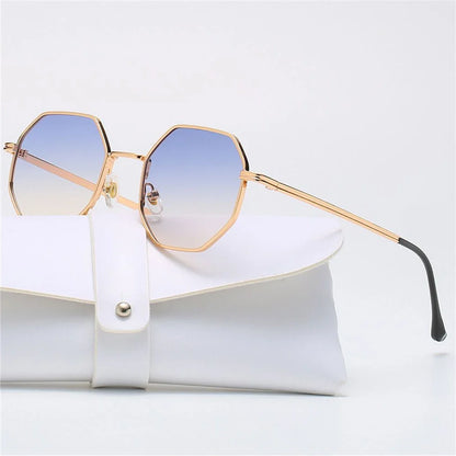 Modern unisex eyewear, gold frame tetragon shades, blue lenses.
