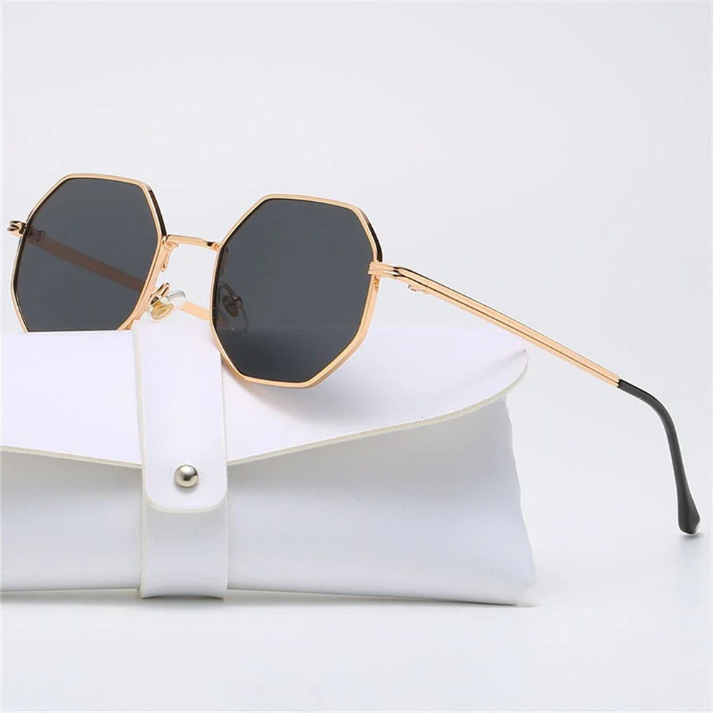 Geometric UV protection sunglasses, black frame, stylish & unisex.