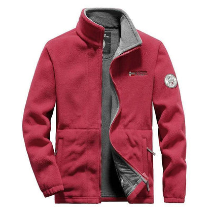 Group of adventurers wearing unisex thermal fleece tactical jackets, enjoying windproof outdoor sports