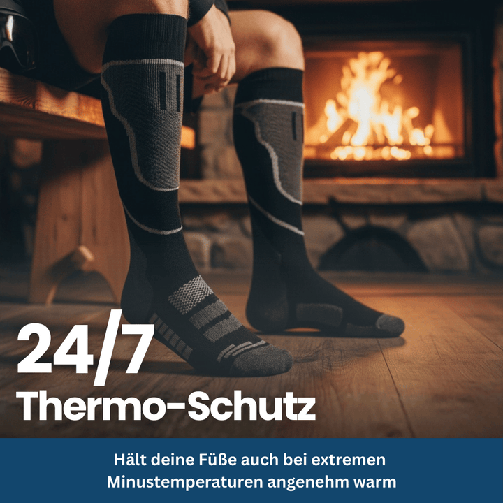 Pair of unisex snowboard socks, blue and black, featuring cushioning for enhanced performance and warmth.