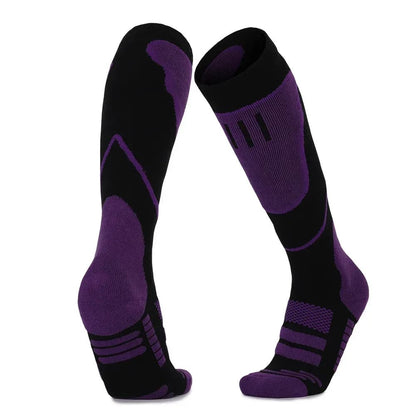 Collection of unisex thermal socks in various colors, ideal for skiing, snowboarding, and other winter sports.