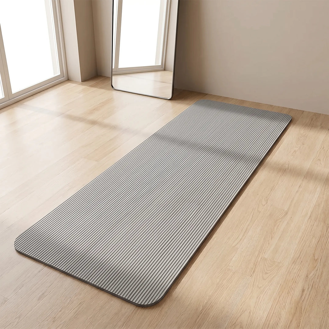Unisex thick fitness mat for high-impact workouts, offering joint support & comfort for home gym.