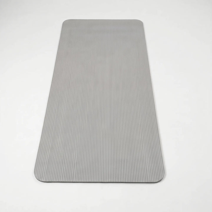 Durable workout mat for high-impact exercise, providing joint cushioning & stability for home gym use.