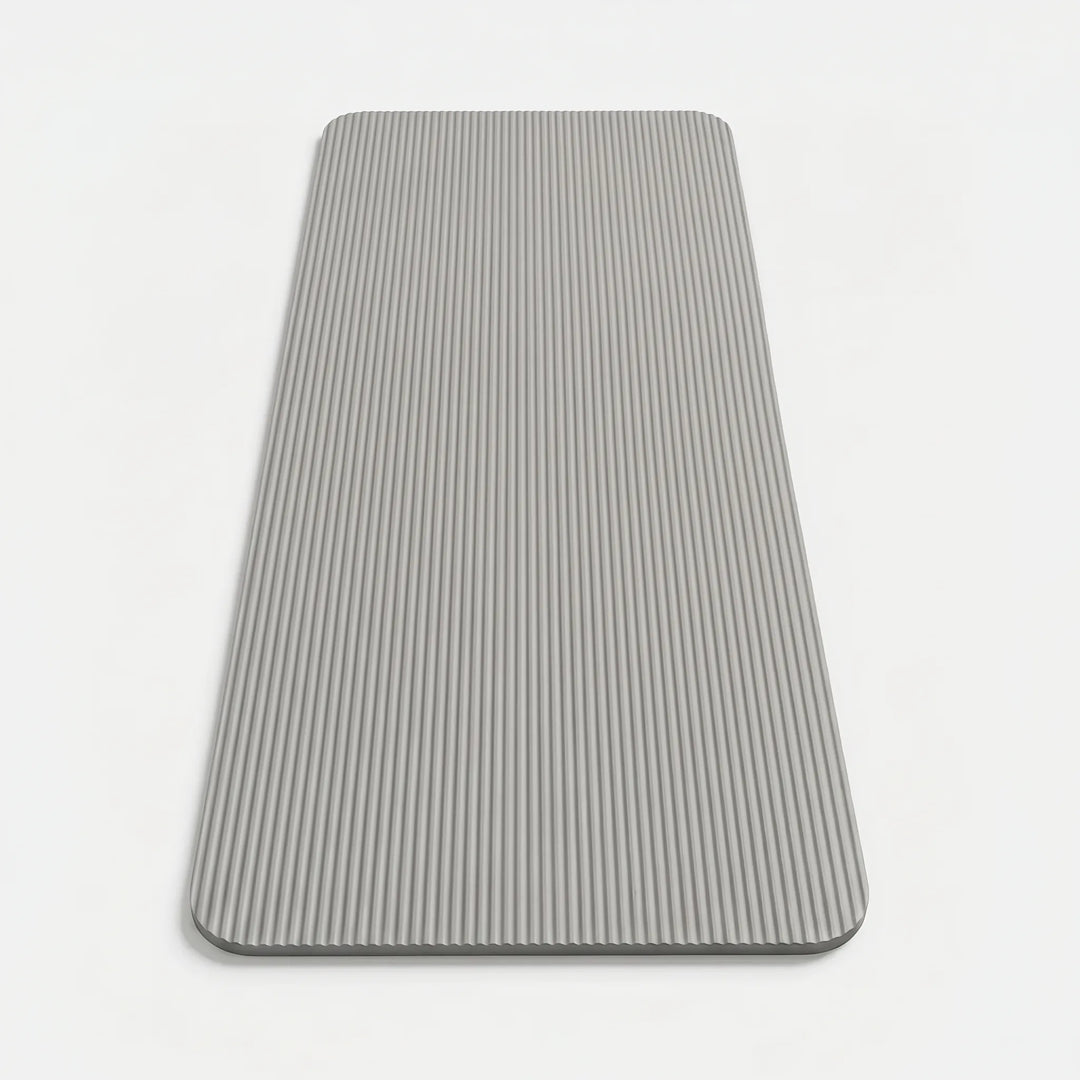 Portable exercise mat, ideal for yoga, Pilates, & high-impact training in any home gym setting.