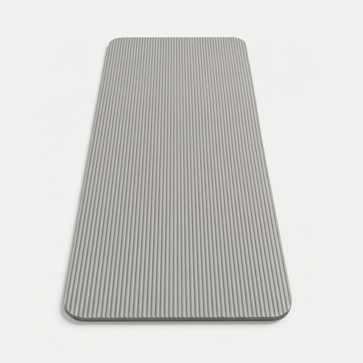 Portable exercise mat, ideal for yoga, Pilates, & high-impact training in any home gym setting.