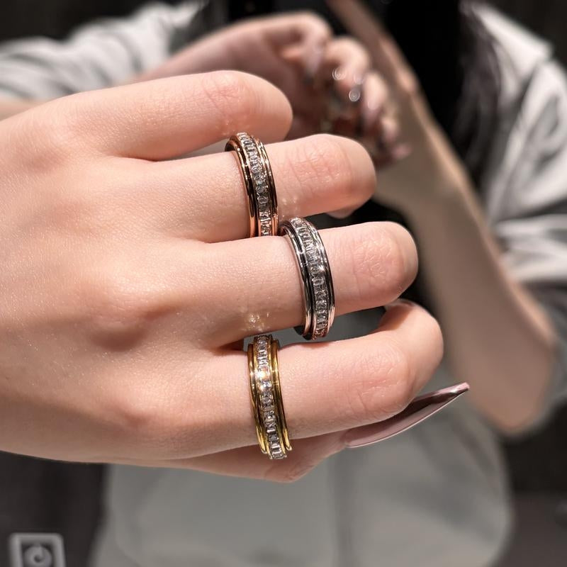 Fashionable unisex titanium steel spinner ring with CZ, a discreet fidget for anxiety relief.