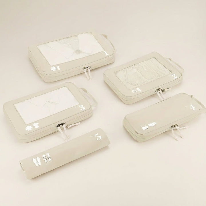 Unisex travel compression packing cube set by OrgaSwift, designed for efficient luggage organization & space saving.