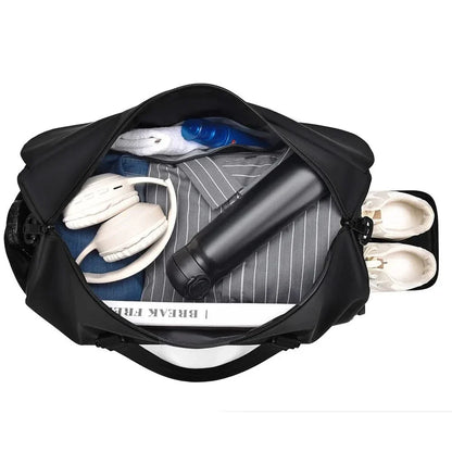 Interior view of black travel duffle bag, showing roomy main compartment and side pockets.
