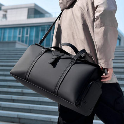 Versatile black unisex duffle bag with shoe compartment, ideal for weekend travel & gym.
