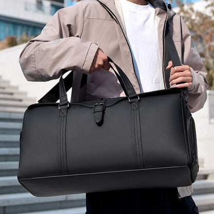 Grey weekend duffle bag, a stylish carry-on for men's & women's overnight trips. Adjustable strap.