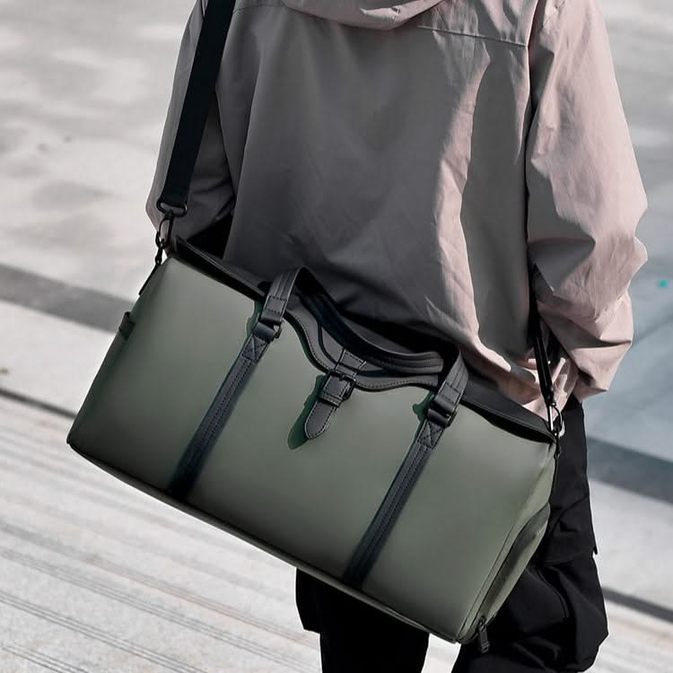 Modern grey duffle bag, a unisex overnight travel bag with sturdy handles and ample storage.