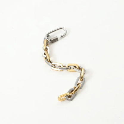 Chunky two-tone unisex bracelet with a unique carabiner clasp, crafted from gold-plated stainless steel.