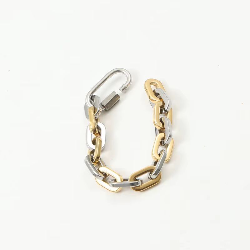 Stylish unisex two-tone carabiner bracelet, a chunky gold-plated stainless steel fashion jewelry piece.