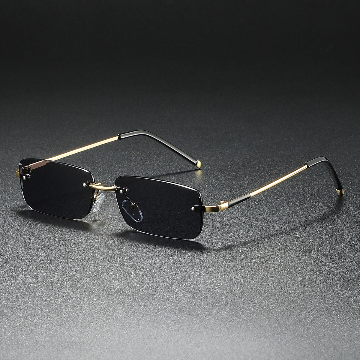 Luxury unisex ultra-light rimless rectangular sunglasses. Modern, fashionable sun protection accessory.