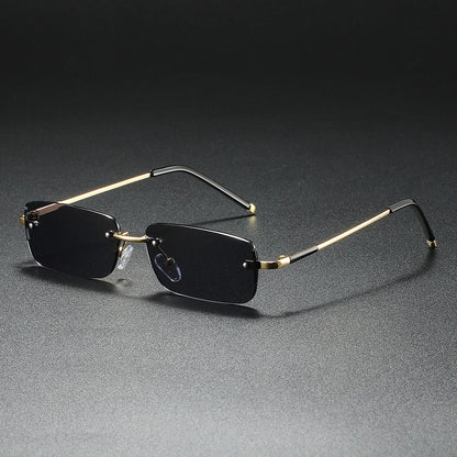Luxury unisex ultra-light rimless rectangular sunglasses. Modern, fashionable sun protection accessory.