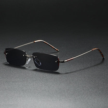 Fashionable rimless rectangular sunglasses with gradient lenses. Lightweight unisex eyewear for sleek style.