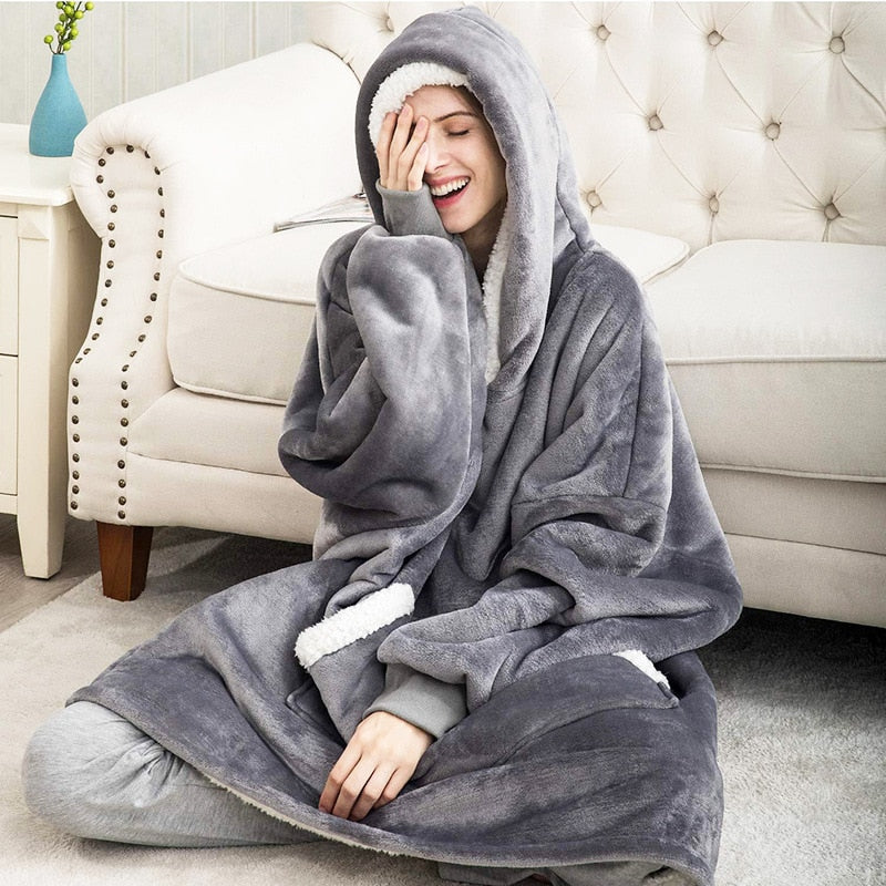 Unisex ultra-soft wearable blanket hoodie in cozy grey, perfect for lounging & warmth.