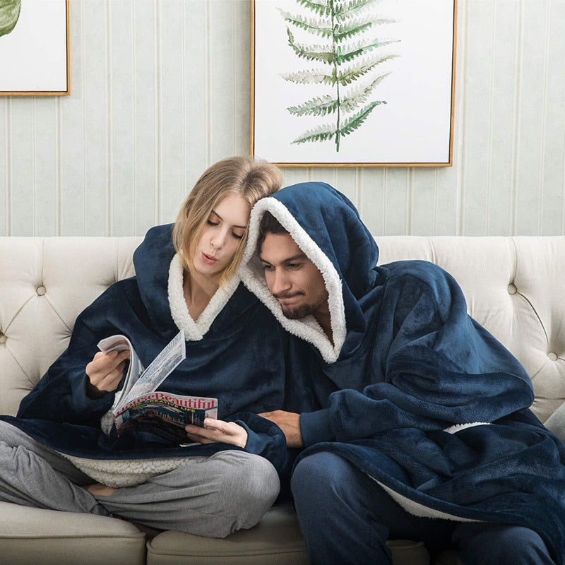 Cozy unisex wearable blanket with hood and pocket, providing snug warmth for cold days.