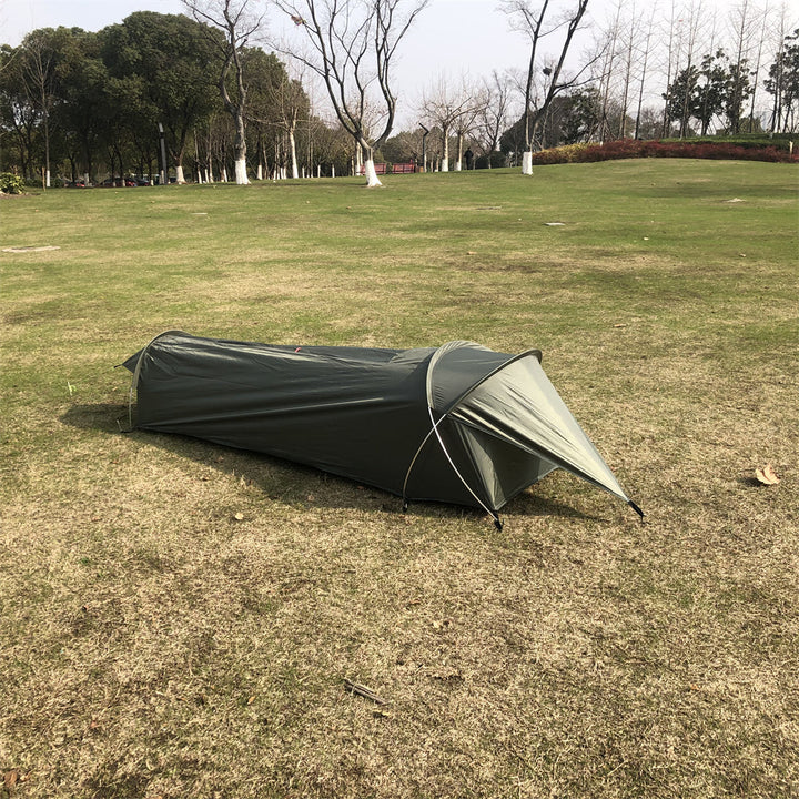 Side view of a single person backpacking bivy tent shelter, ideal for minimalist camping.