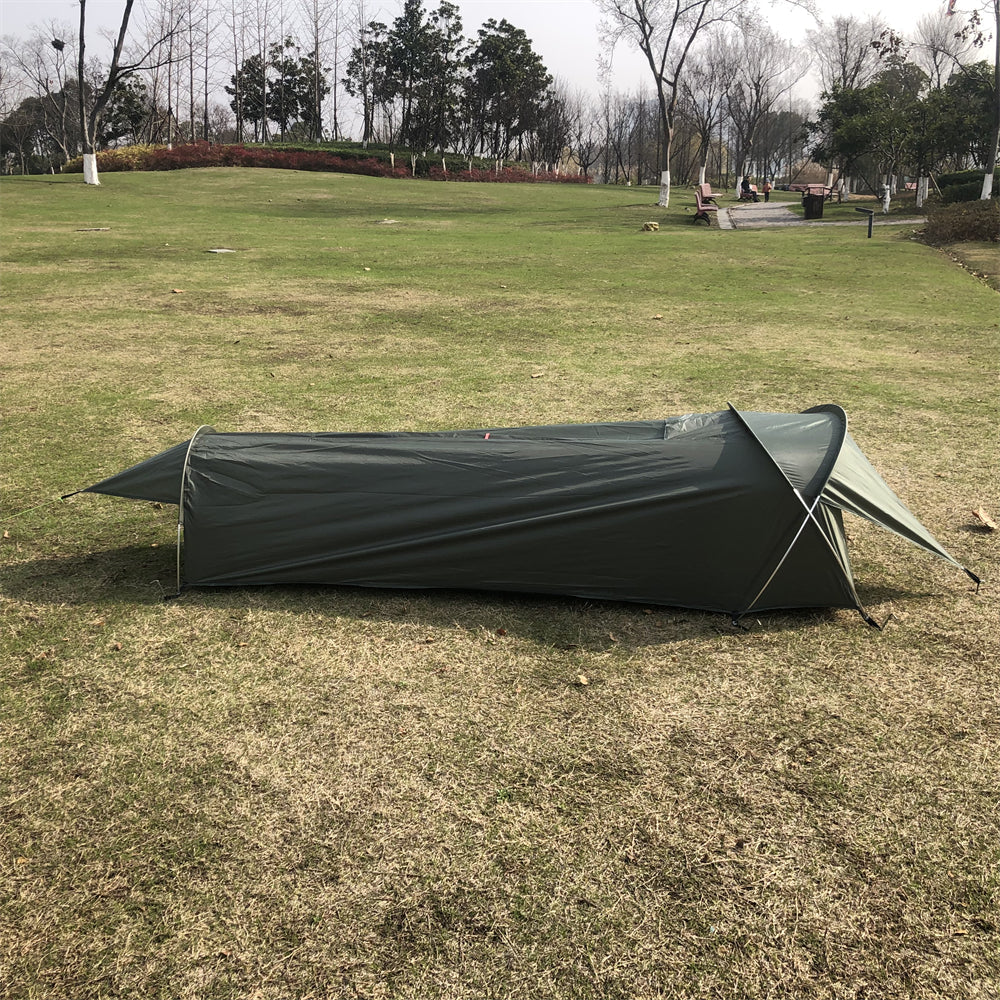 Front view of an ultralight 1kg bivy tent with an open entrance, ready for outdoor sleeping.