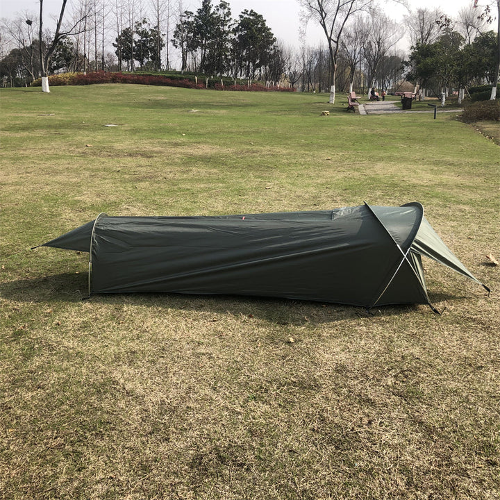 Front view of an ultralight 1kg bivy tent with an open entrance, ready for outdoor sleeping.